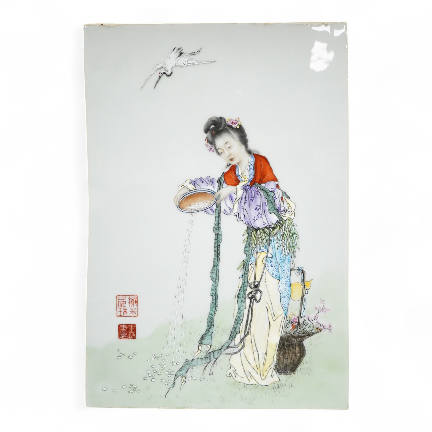 A Chinese famille rose porcelain plaque depicting a woman feeding birds, 36cm high
